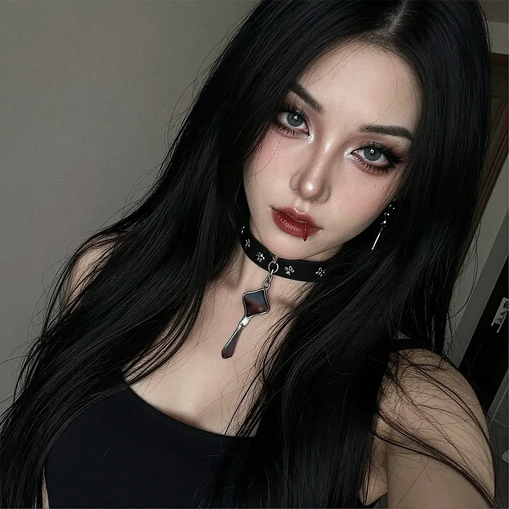Woman with long black hair and blue-green eyes wearing leather cross choker with blood-tear makeup and red lipstick